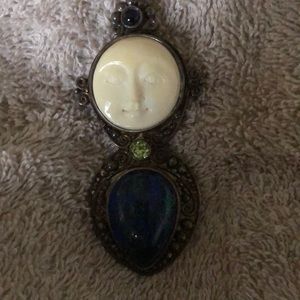 Carved bone man in the moon pendant/brooch